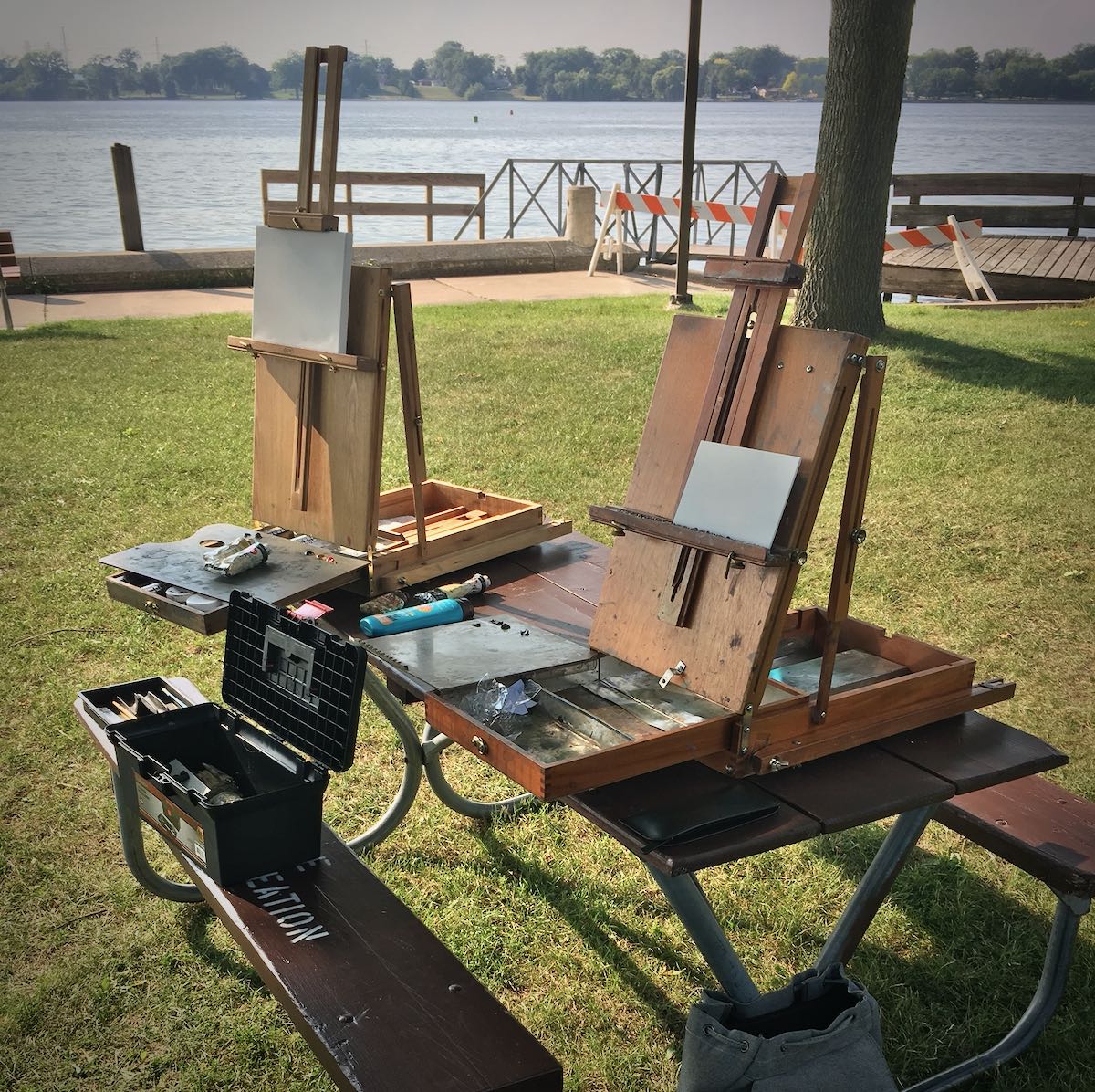 Painting easels on a park bench